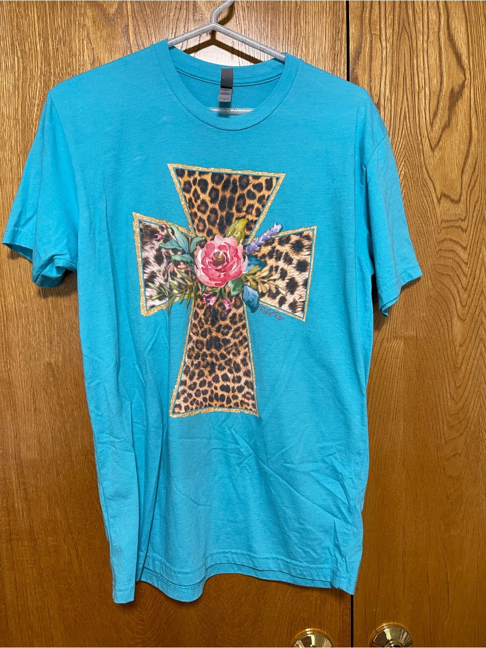Next Level Apparel Turquoise Short Sleeve Tee with Leopard Cross & Floral Accent